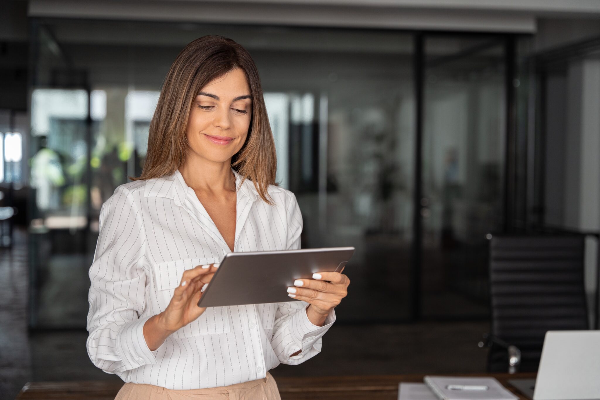 Woman using a tablet in an office